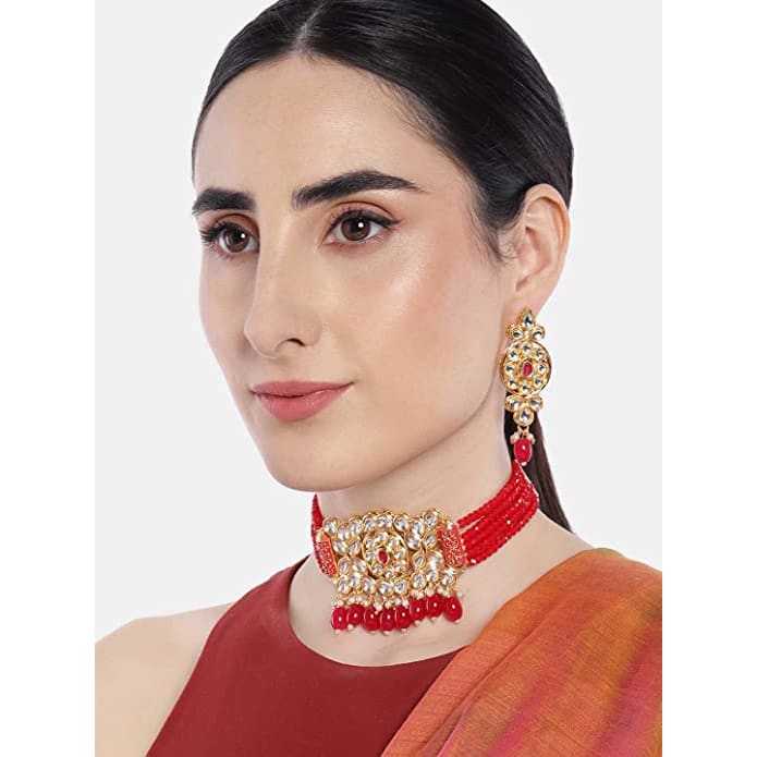 Gold toned Kundan and ruby choker Jewellery set