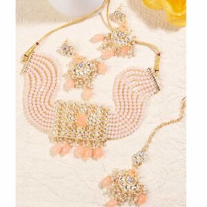Gold toned Kundan and Pink enamel Jewellery set embellished with pearls and bead for women and girls