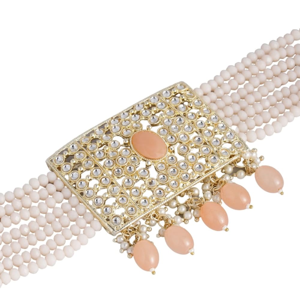 Accessher Gold toned Kundan and Pink enamel Jewellery set