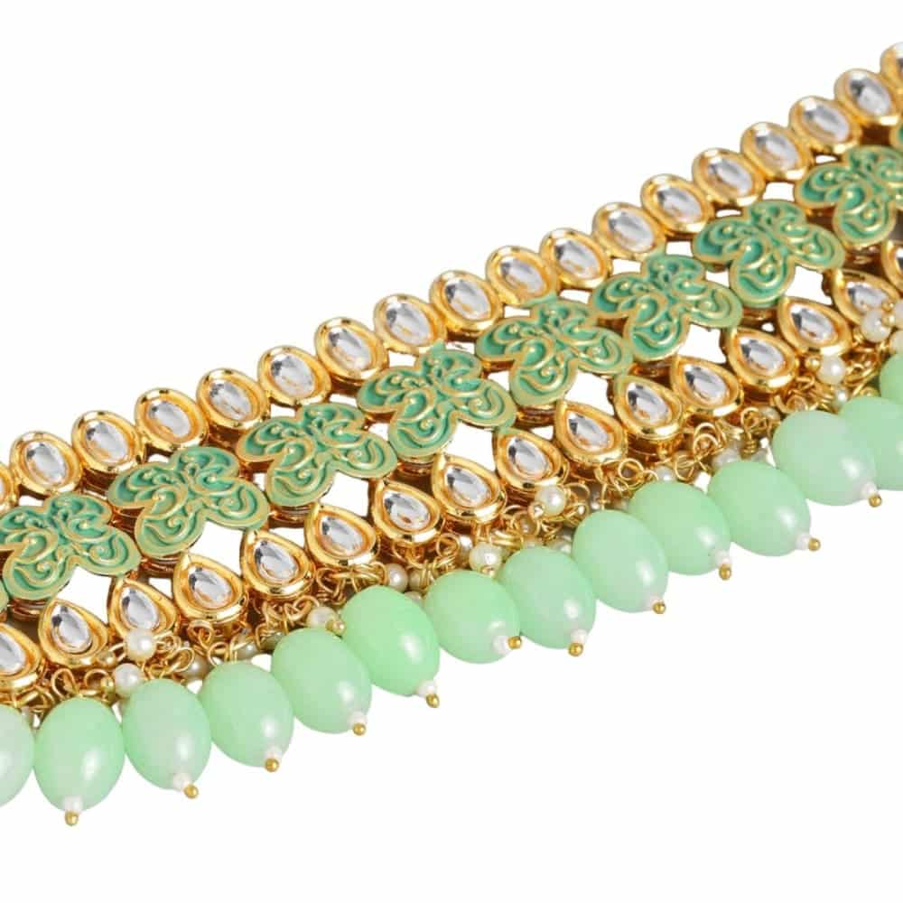 Gold toned Kundan and mint green enamel Jewellery set