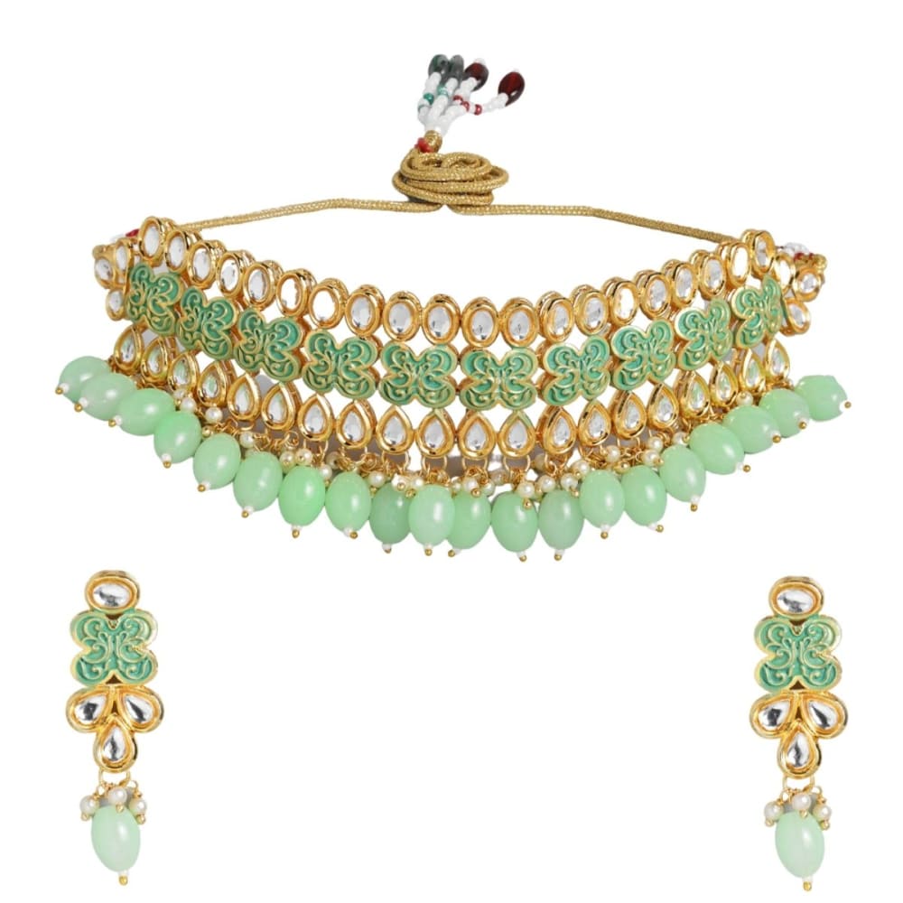 Gold toned Kundan and mint green enamel Jewellery set